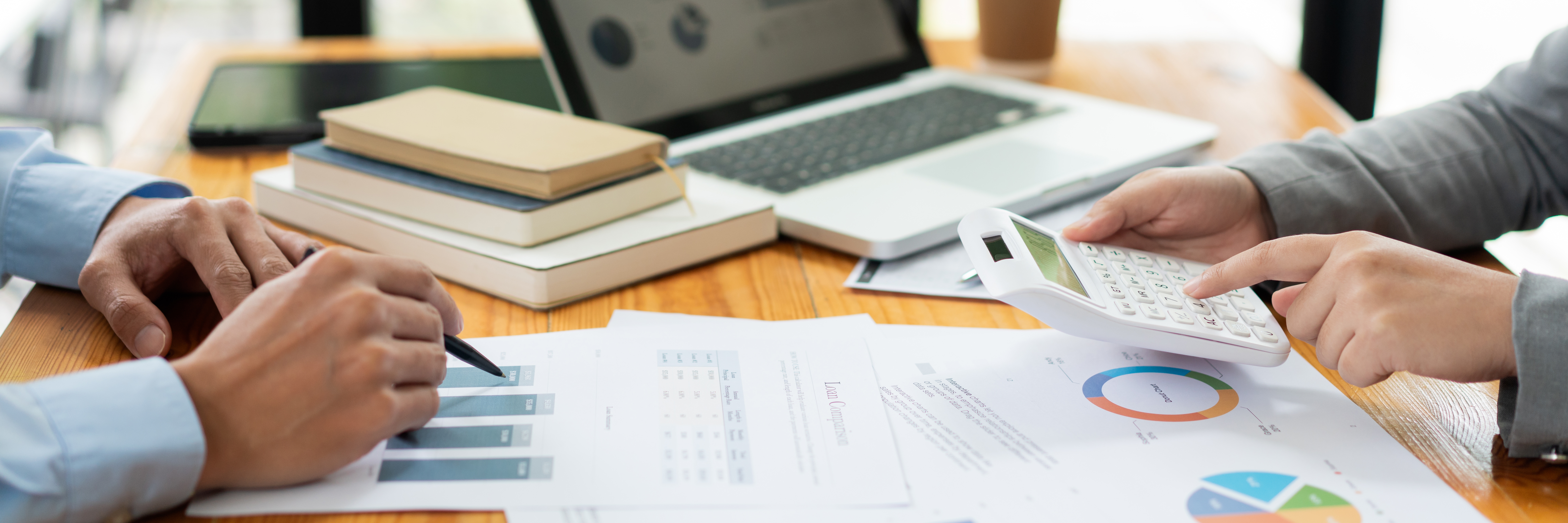 female broker estimating the number of estate and checking it with the male broker.