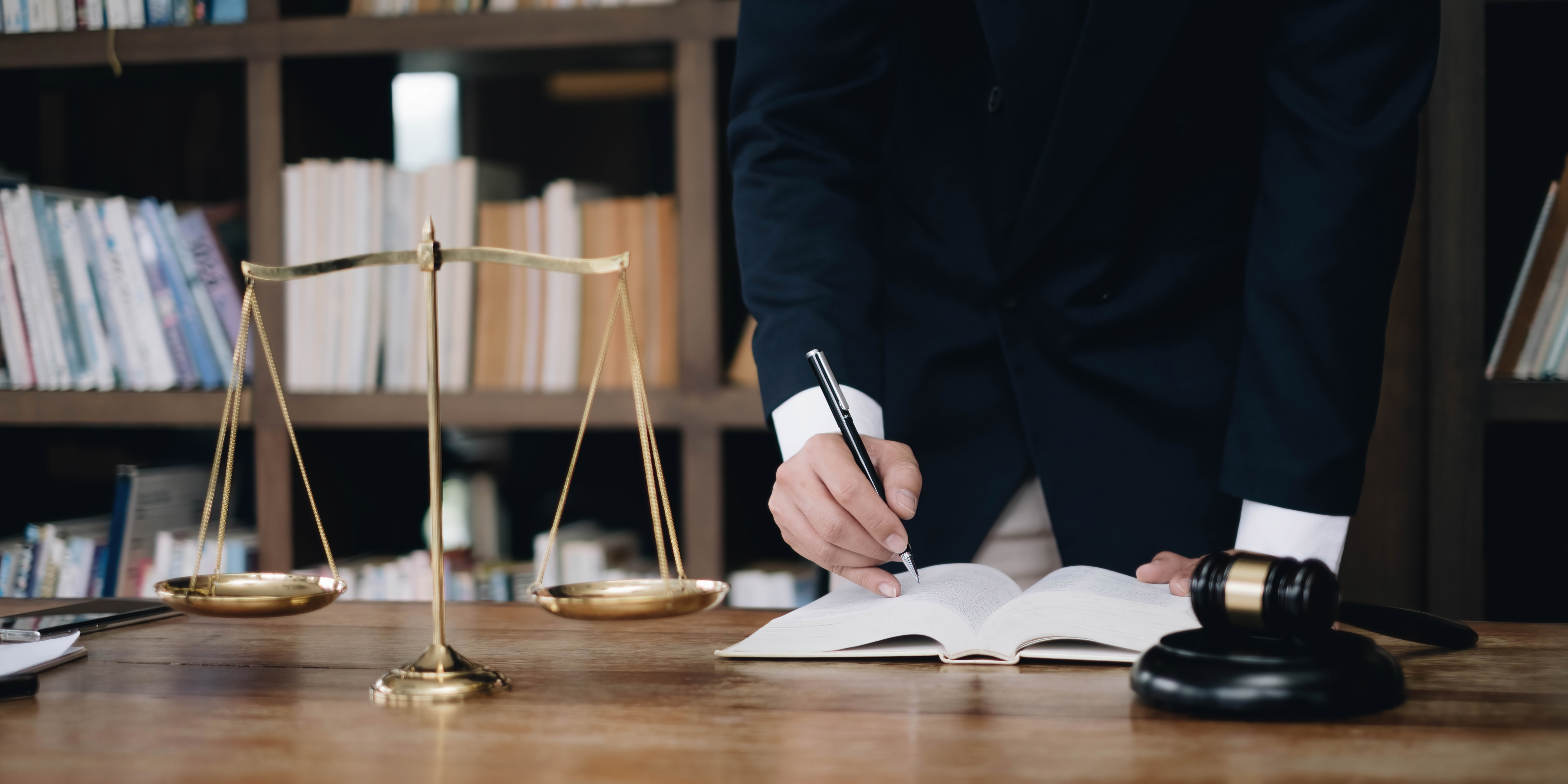 justice and law concept.Male judge in a courtroom on wooden table and Counselor or Male lawyer